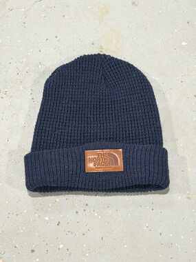 The North Face Navy Knit Cuffed Beanie with Brown Leather Logo